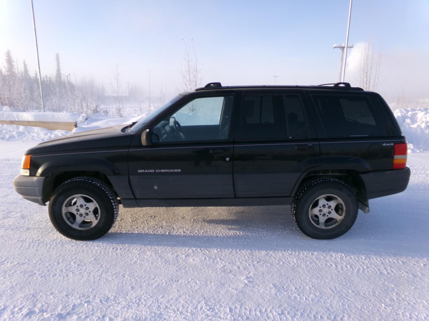 1997 Black Jeep Grand Cherokee Laredo 4WD (1J4GZ58S6VC) with an 4.0L L6 OHV 12V engine, 4-Speed Automatic Overdrive transmission, located at 2630 Philips Field Rd., Fairbanks, AK, 99709, (907) 458-0593, 64.848068, -147.780609 - Photo#2